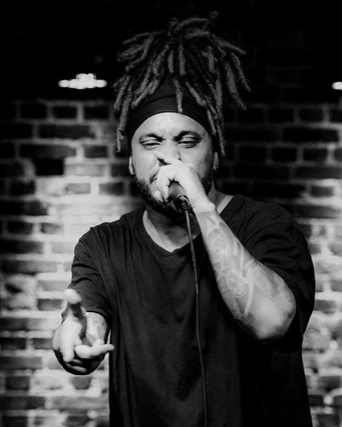 Man in puffer jacket with silver necklace